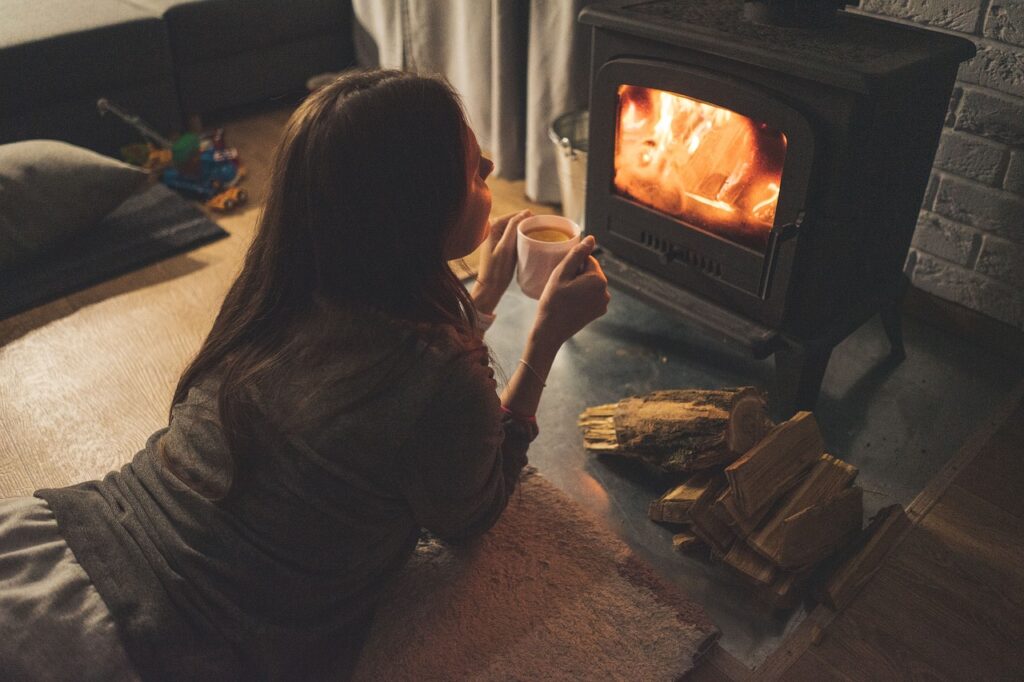 woman, fireplace, coffee cup-6795381.jpg